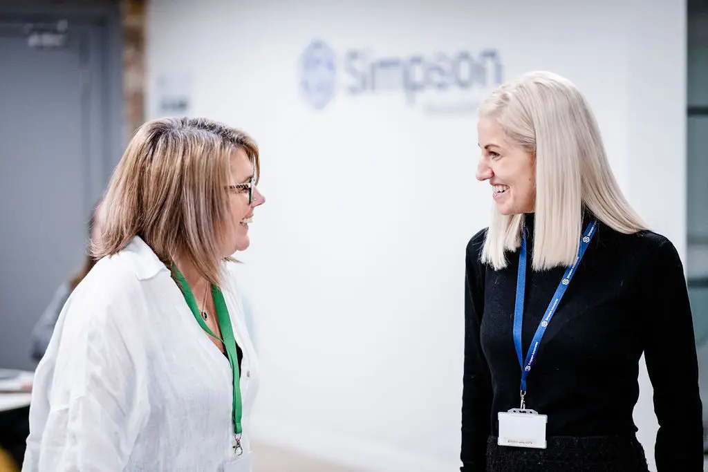 Team members having a discussion in the office