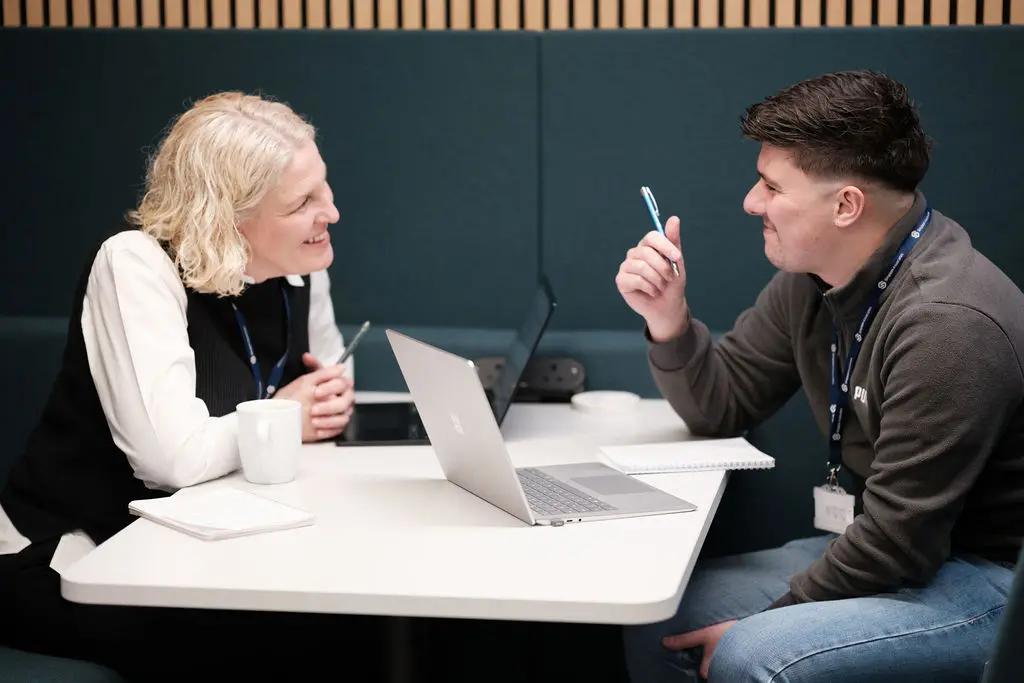 two team members discussing data