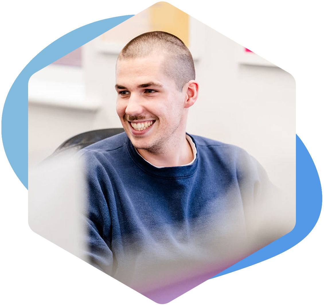 microsoft fabric consultant smiling at desk