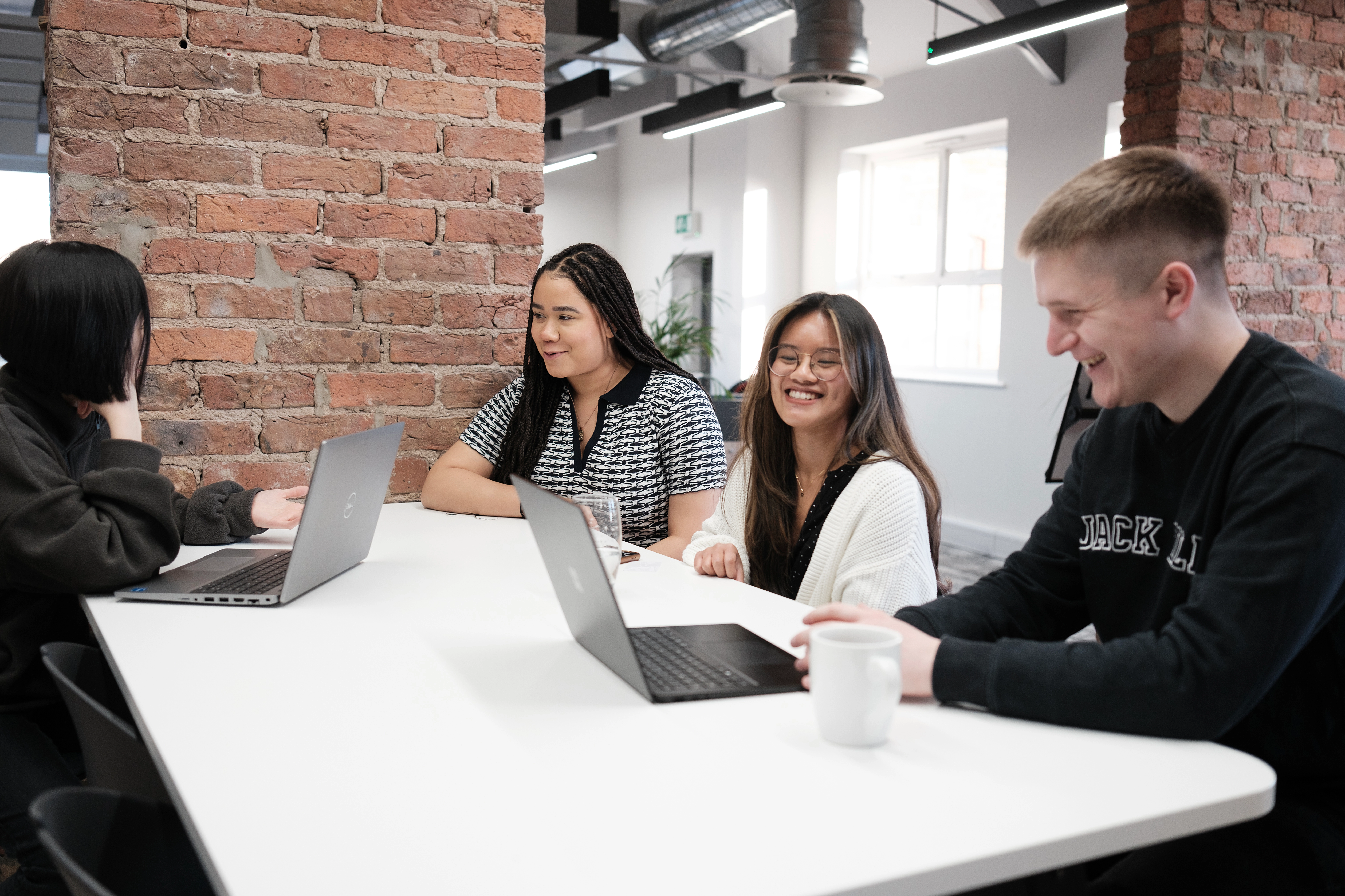 Team talking, on laptops