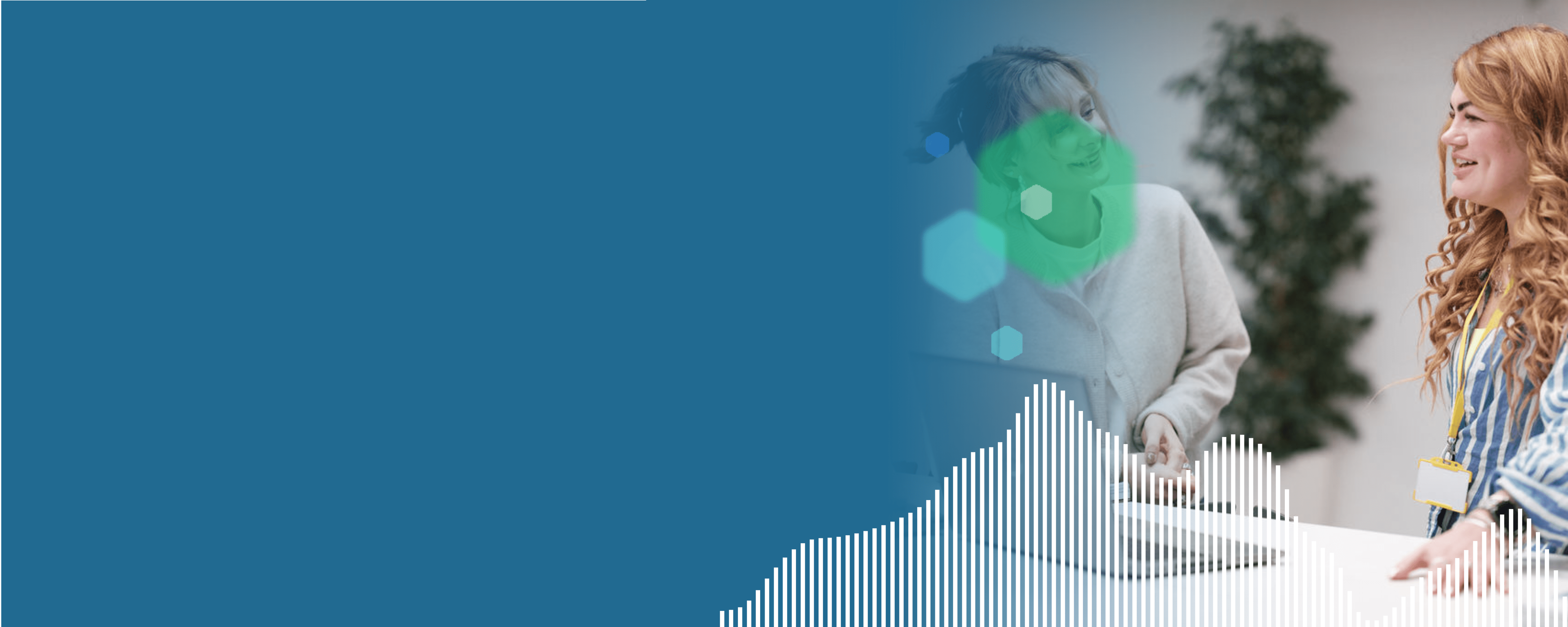A blue header with geometric shapes, containing an image of two employees smiling at a table in front of a computer. 