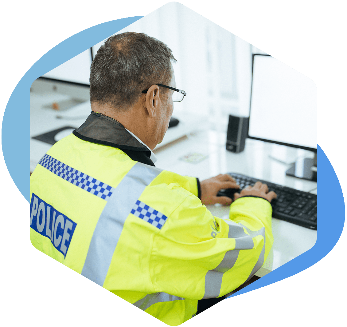 policeman working on computer