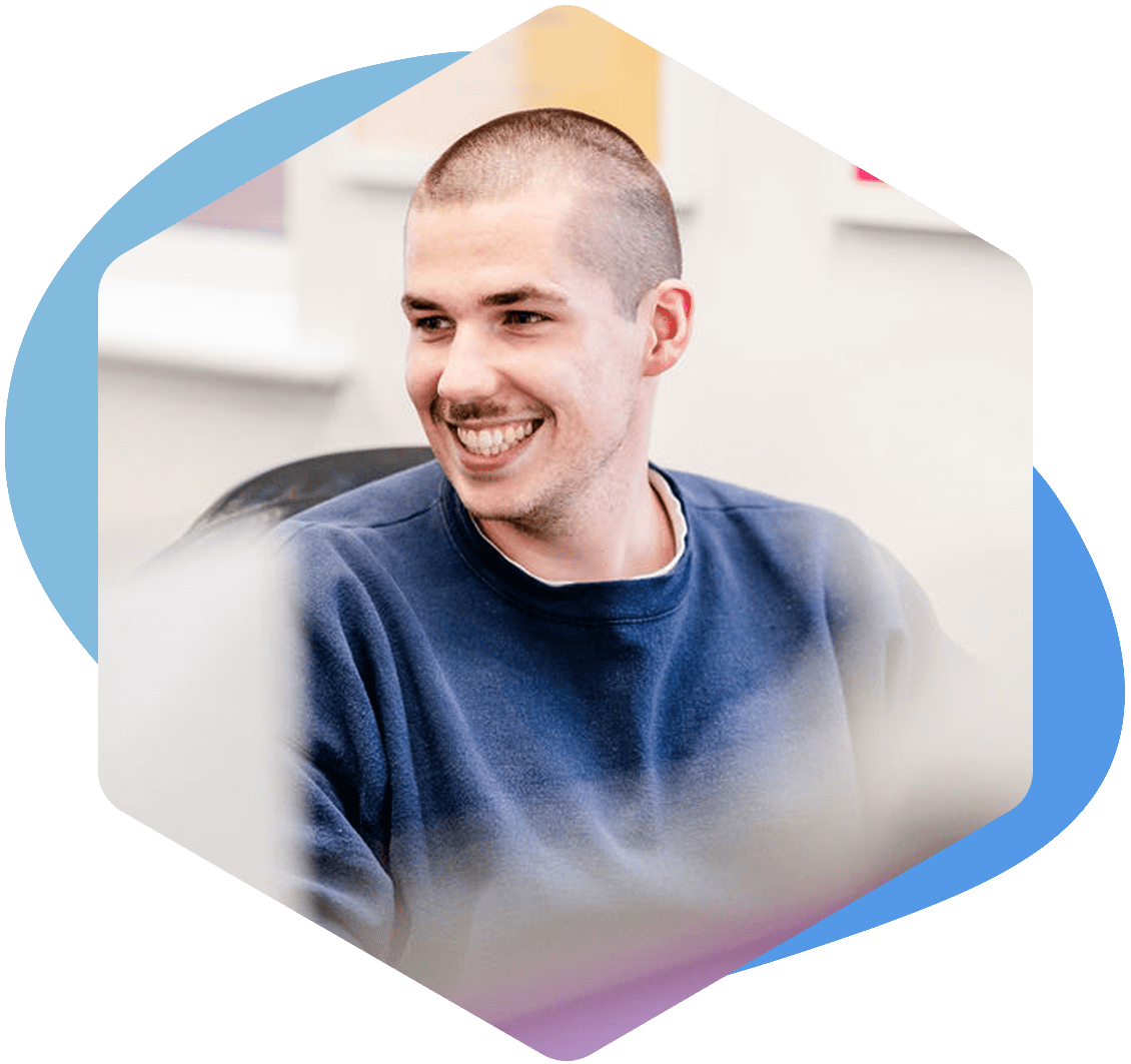 microsoft fabric consultant smiling at desk